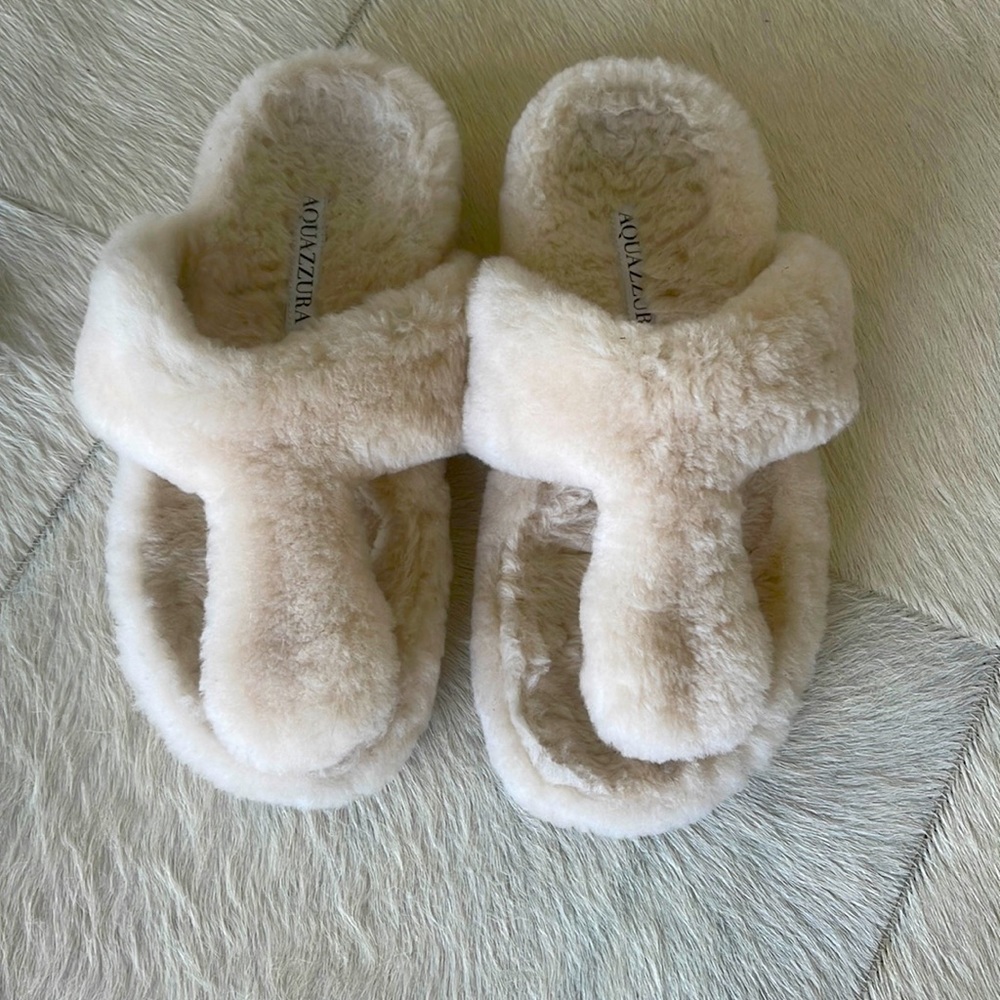 Shearling slippers/sandals  with a non skid rubber sole so can be worn outside.